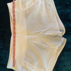 Lululemon Women’s white speed shorts size 8 with 4 inch inseam.